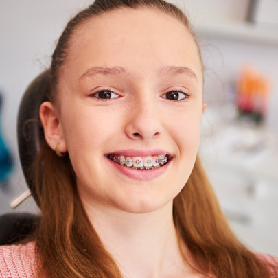 smiling child with braces smiling child with braces